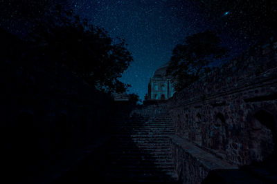 Low angle view of old building against sky at night