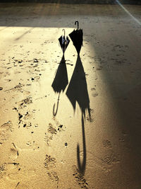 High angle view of text on sand at beach