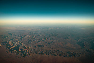 Aerial view of dramatic landscape against sky