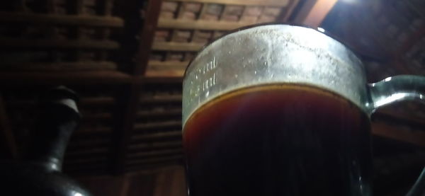 Close-up of beer glass on table