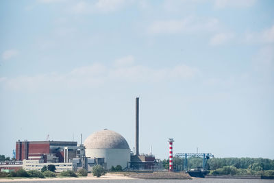 Panoramic view of factory against sky