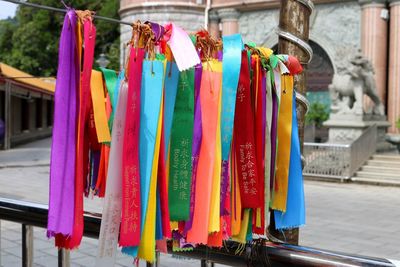 Close-up of multi colored flags hanging at market stall