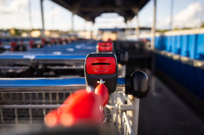 Close up of a row of grocery carts.