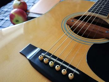 High angle view of guitar on table