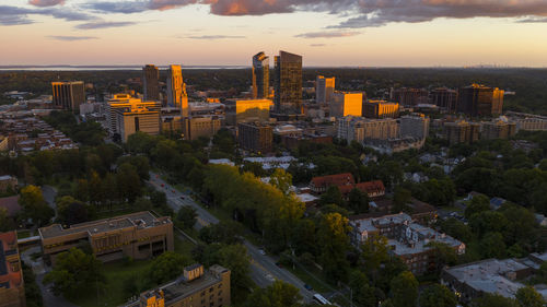 High angle view of buildings against sky during sunset