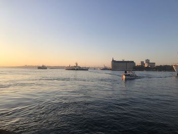Scenic view of sea against clear sky during sunset