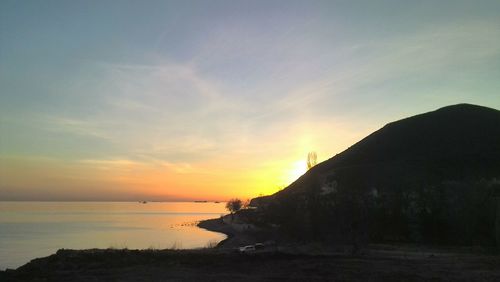 Scenic view of sea against sky during sunset