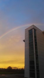 Low angle view of building against sky during sunset