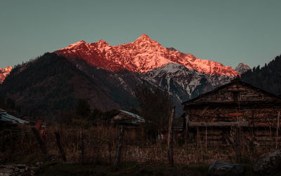 Scenic view of snowcapped mountains against clear sky