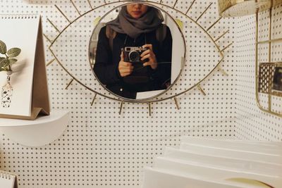 Close-up of man sitting in bathroom