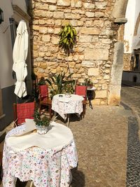 Chairs and tables against wall