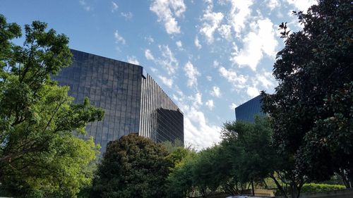 Low angle view of building against cloudy sky