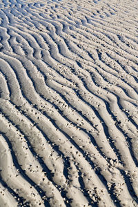 High angle view of tire tracks on snow covered land