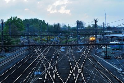 Train on railroad tracks against sky