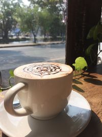 Close-up of coffee cup on table