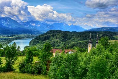 Scenic view of mountains and buildings against sky