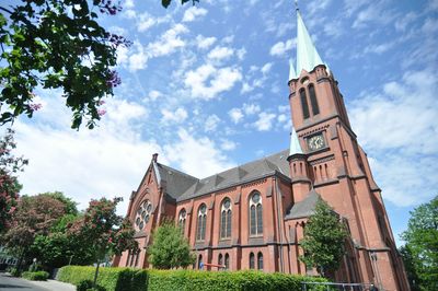 Low angle view of bell tower against sky