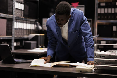 Side view of businessman working at office