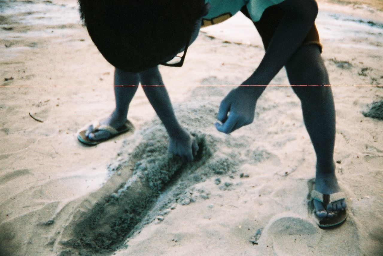 LOW SECTION OF PEOPLE WALKING ON FOOTPATH