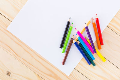 High angle view of multi colored pencils on table