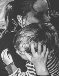 Close-up portrait of mother and daughter