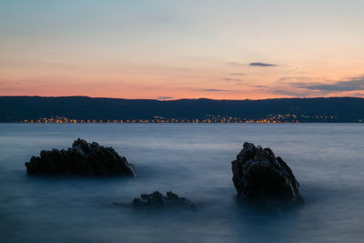 Scenic view of sea at sunset