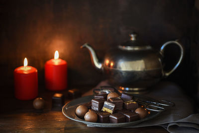 Close-up of candles on table