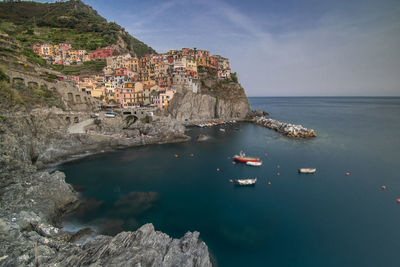 Scenic view of sea and rocks against sky