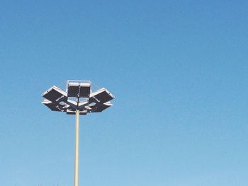 Low angle view of street light against clear blue sky