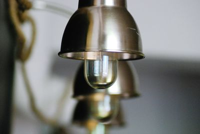 Close-up of water faucet on table