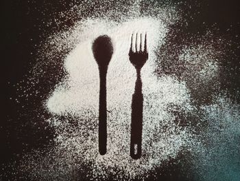 Close-up of fork over black background
