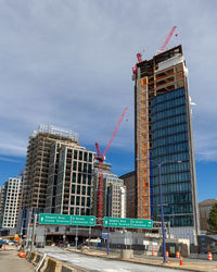 Modern buildings against sky in city