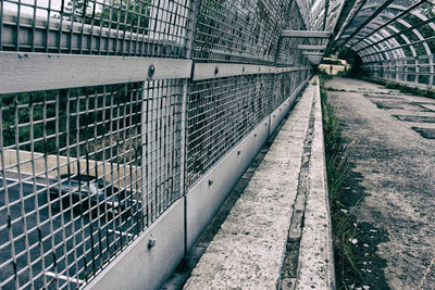 Metal fence by building in city