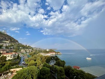 Scenic view of rainbow over the monte carlo beach club sea and sky