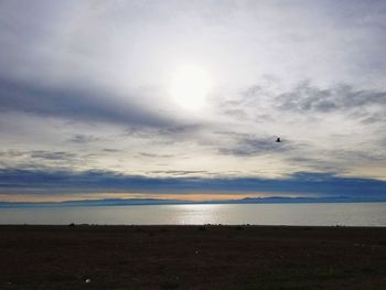 Scenic view of sea against cloudy sky