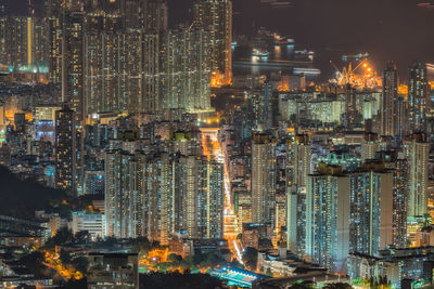 Aerial view of city lit up at night