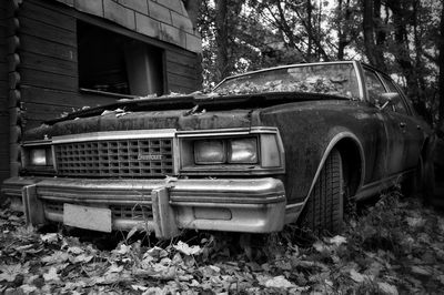 Abandoned car in yard