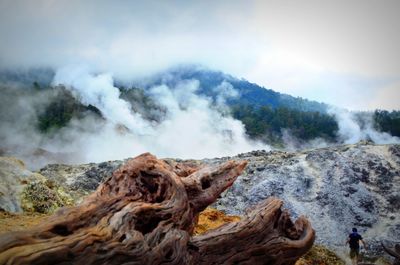 Smoke emerging from volcanic landscape