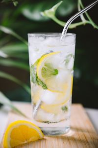 Close-up of lemon soda in glass on table