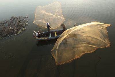 High angle view of people on boat in sea