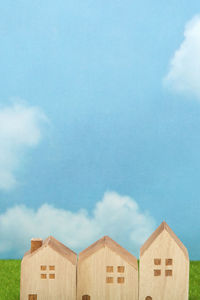 Low angle view of buildings against cloudy sky