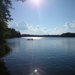 Sun shining over lake