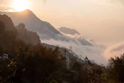 Scenic view of mountains against sky during sunset