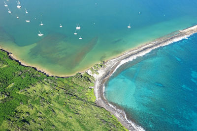 High angle view of sea by landscape