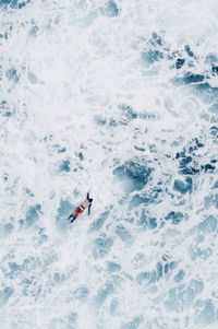 High angle view of man surfing in water