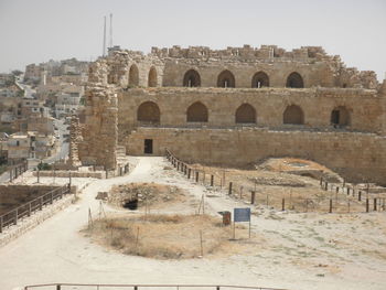 Old ruins against sky in city