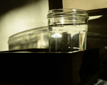 Close-up of water in drinking glass on table