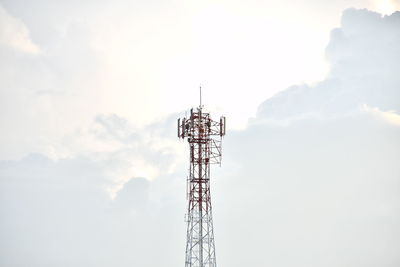 Low angle view of communications tower against sky