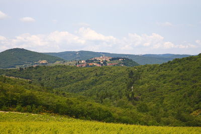 Scenic view of landscape and mountains against sky, tuscany italy