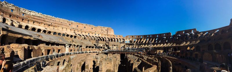 Low angle view of historical building against clear blue sky